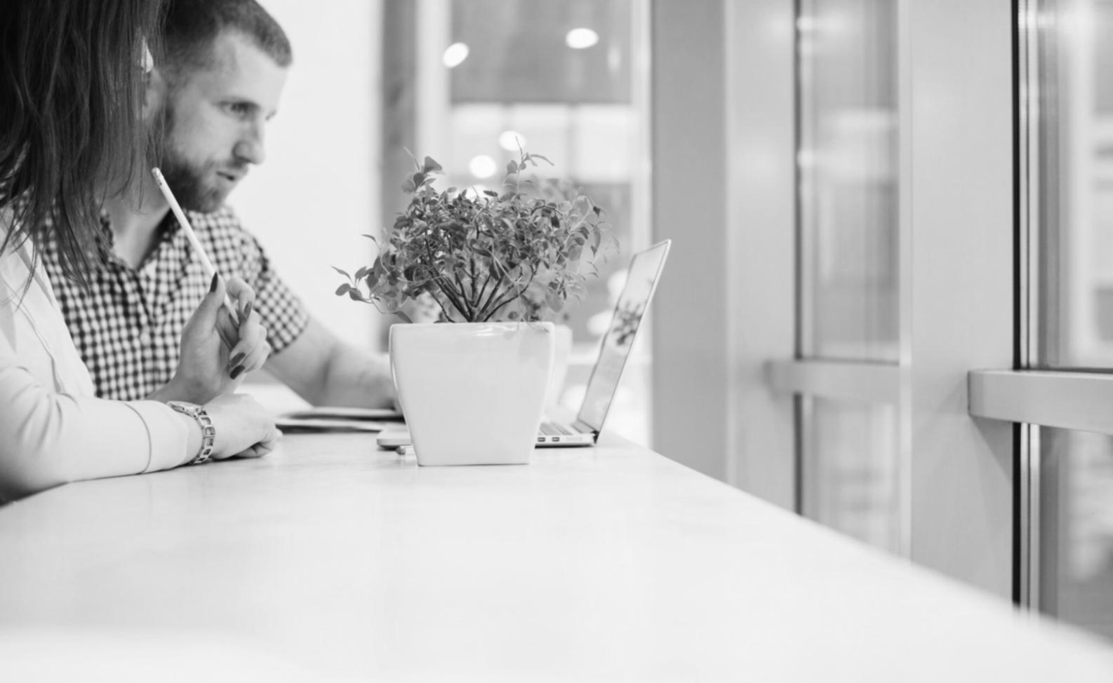 Financial analysis charts and industry benchmark data displayed on modern business workspace